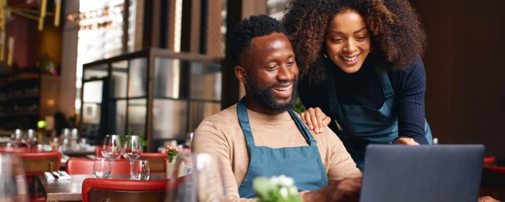 Small business restaurant owners on computer